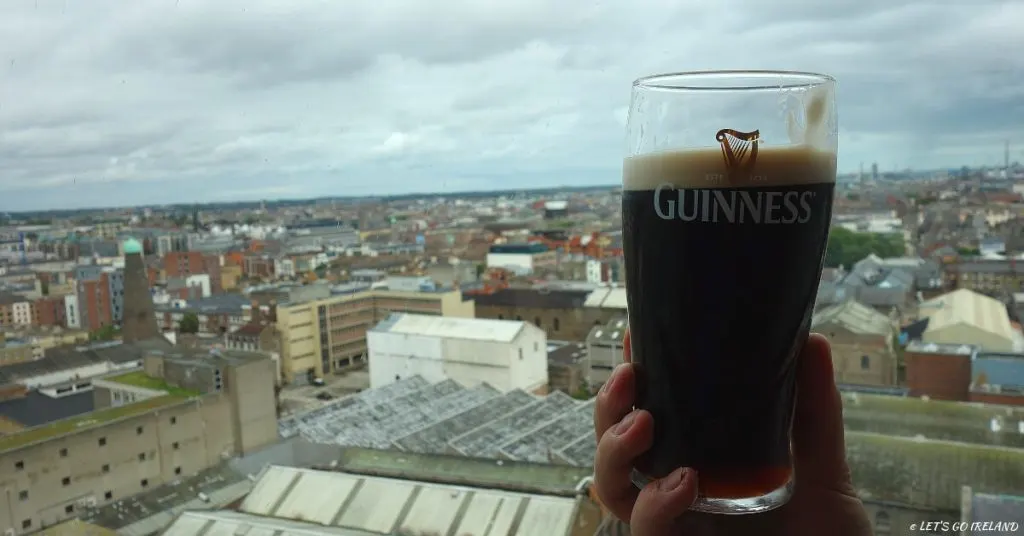 A pint of Guinness with a view of Dublin from the Gravity Bar