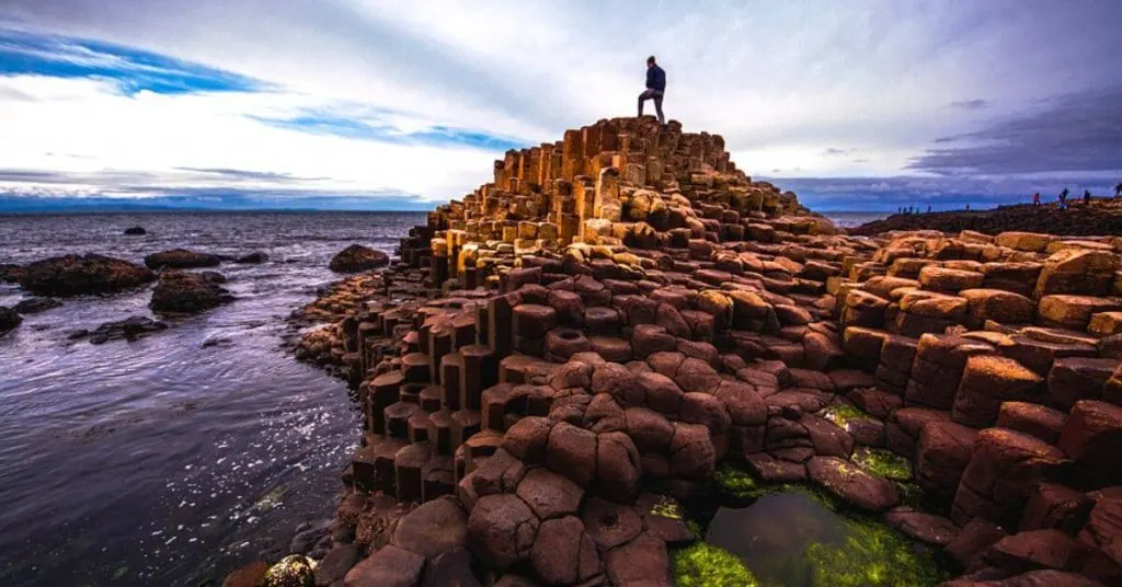 Person admiring the view on  the Giant's Causeway, Northern Ireland.