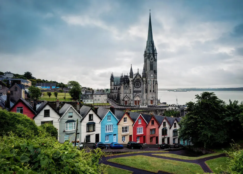 Cobh Cathedral and colorful houses, Cobh, County Cork, Ireland.