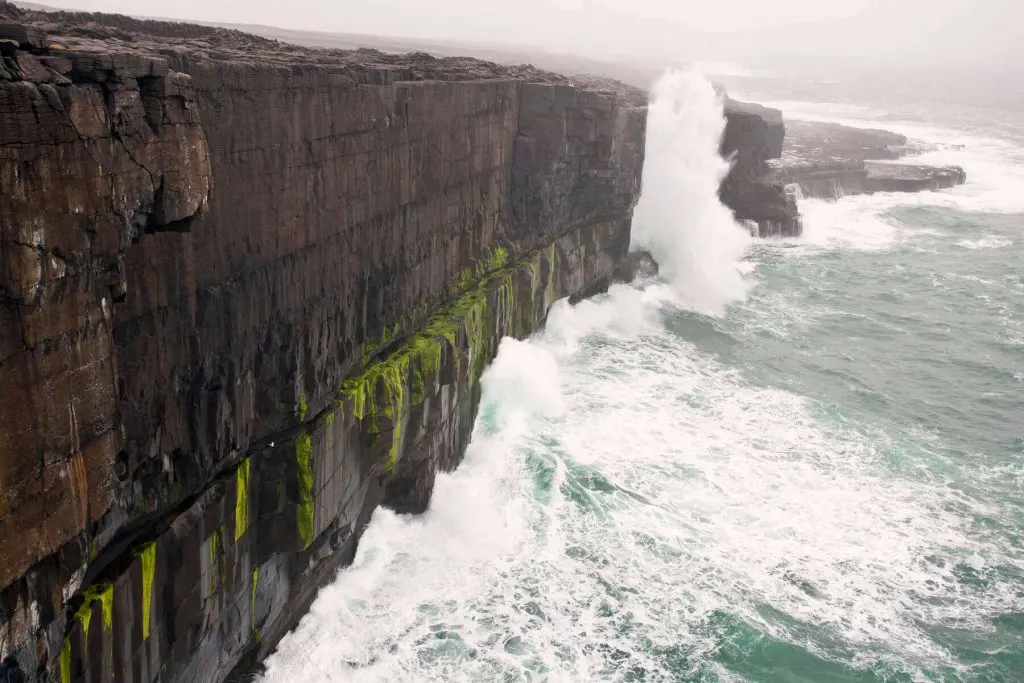 Stormy weather and big waves crash against Inis Mór, one of the Aran Islands off the coast of County Galway. 