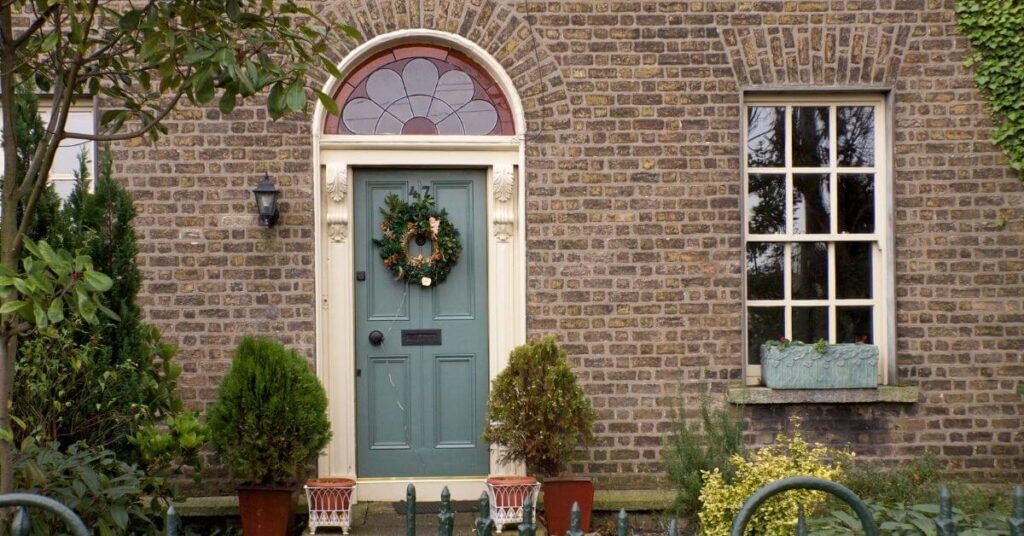 A Christmas wreath hangs outside a house door in Dublin, Ireland.
