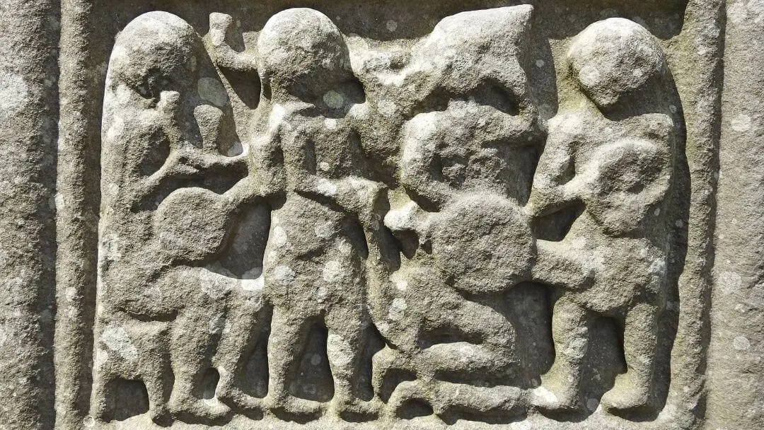 A detailed scene from Muiredach's Cross.