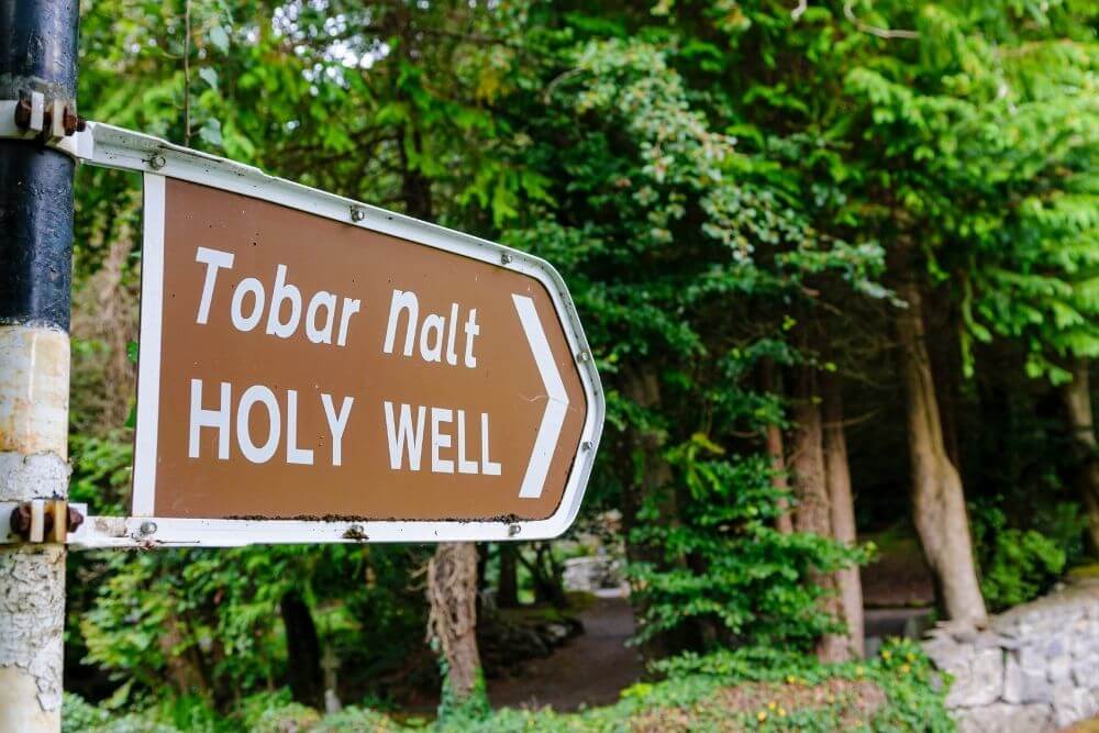sign for a holy well in Holy wells are found throughout Ireland, such as this one in Tobernault, County Mayo.