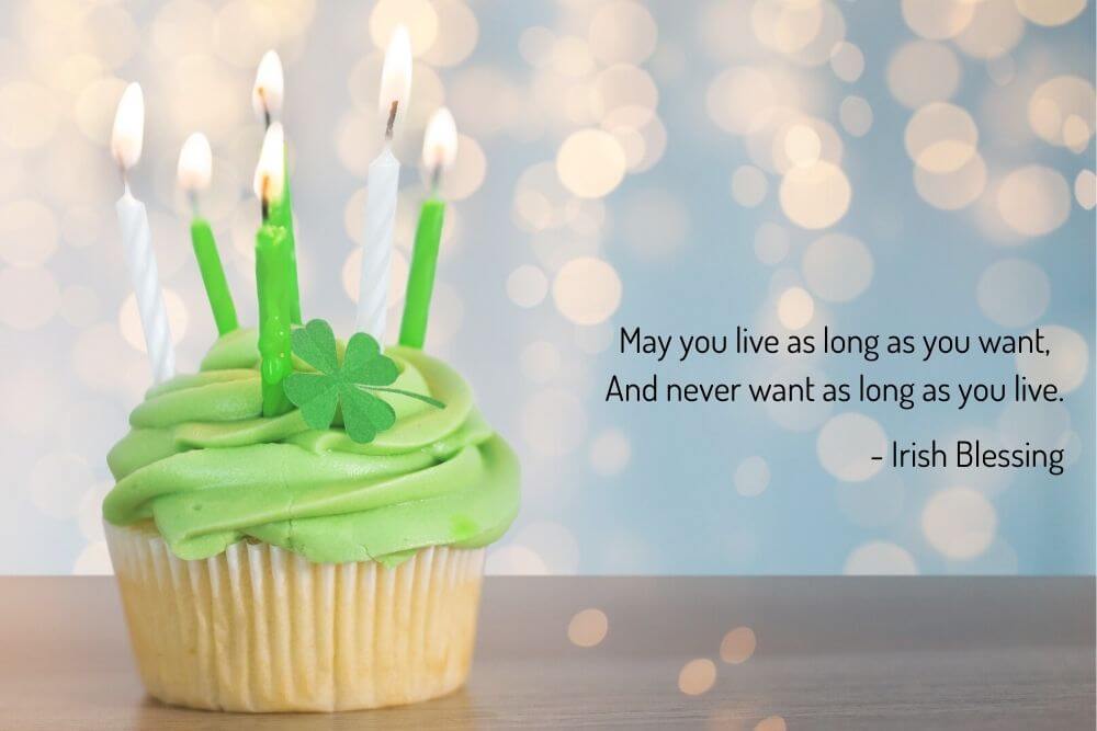 A cupcake with candles and an Irish blessing