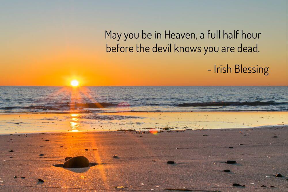 Sunset on a beach with an Irish blessing