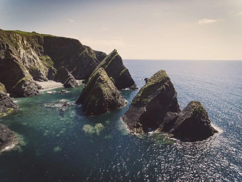 The glistening waters and sea stacks of Nohoval Cove near Kinsale. 