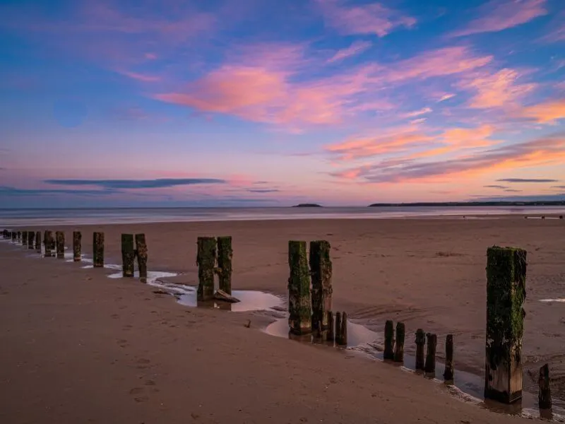 Sunset at Youghal Beach in County Cork. (Photo: John Holmes via Canva)