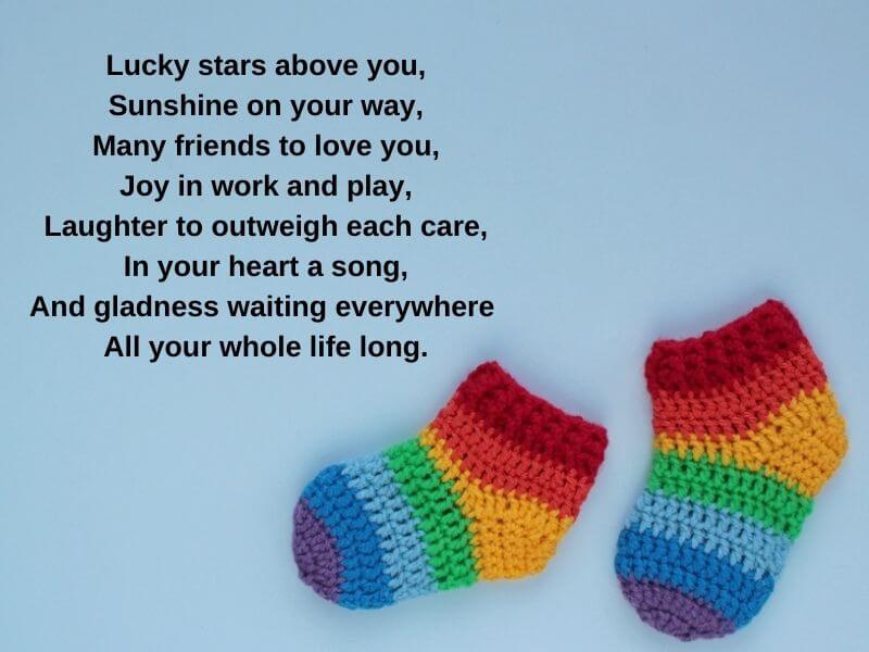 Irish baby blessing text with rainbow baby socks.