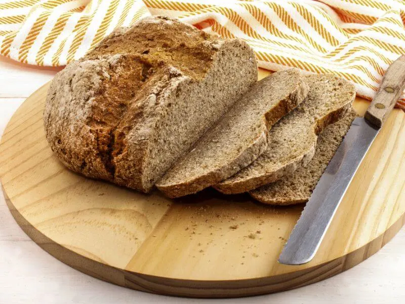 Classic Irish soda bread on a bread board.
