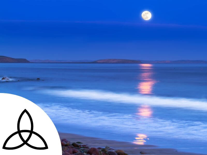 Celtic Trinity Knot with moon and sea in background.