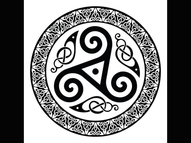 Triskele in a circle with other Celtic patterns. 