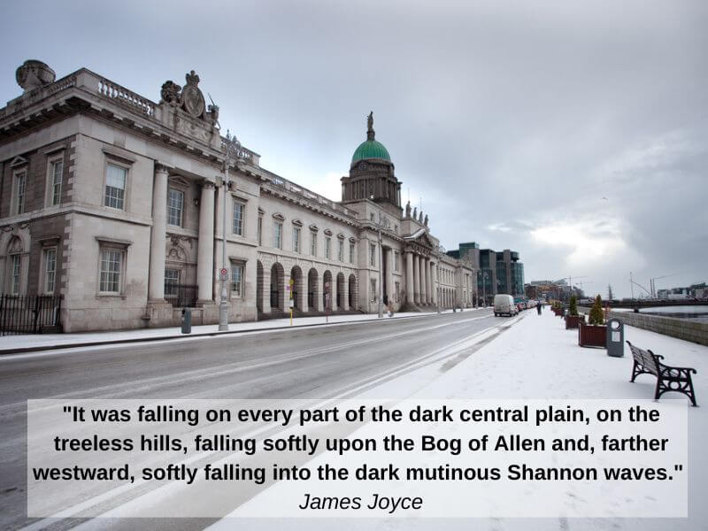 A snowy view of Dublin showing the Custom House Quay Building. 